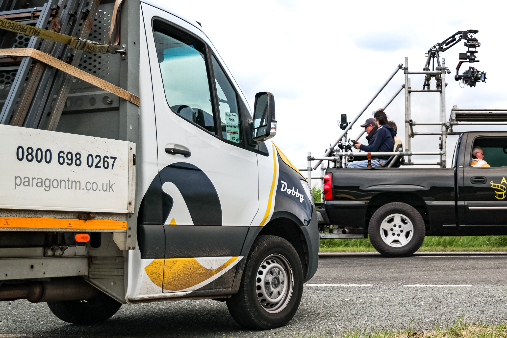 TV Film Crew in Action Vehicle with Paragon Traffic Management Vehicle Standing By